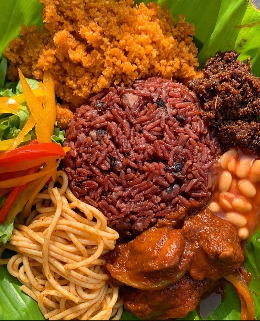Waakye served with spaghetti, salad and chicken